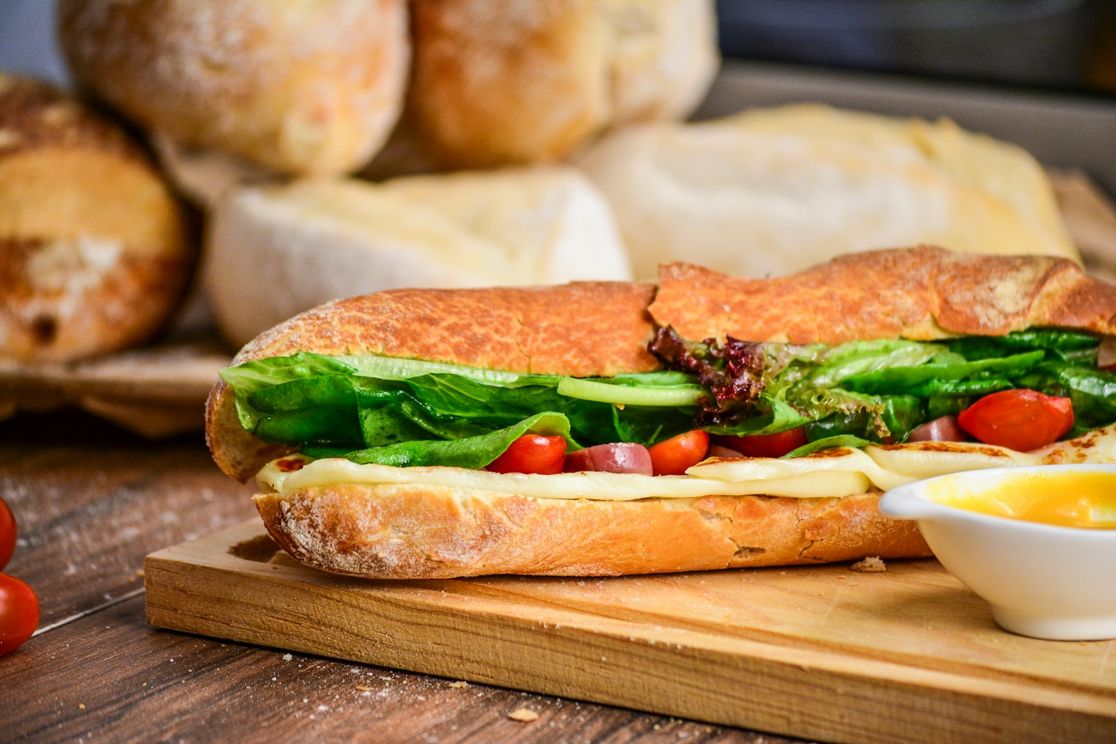 baked bread with vegetable on brown chopping board